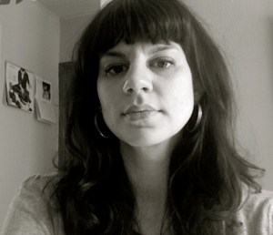 Monica in black and white with long dark hair