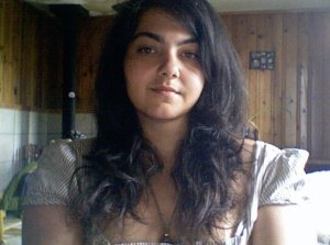 Photo of Marianne, long dark hair.