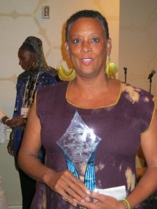 Photo of Claudia Booker in purple dress