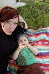 Kelly on a blanket with a baby