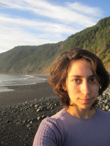 gracie on a beach wearing purple