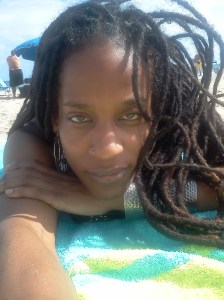 Lisa lying down with braids