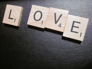 Scrabble tiles spelling out "love"